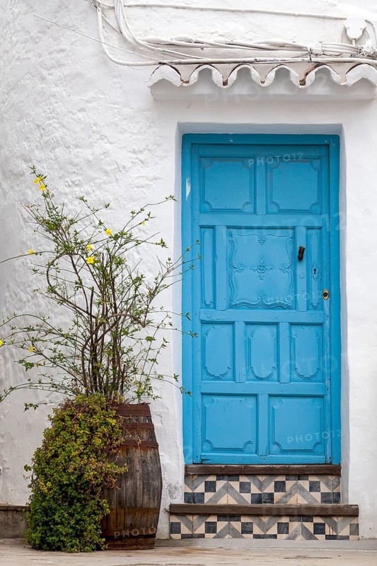 House facade with blue front door, Frigiliana, Costa del Sol, Andalusia, Spain
