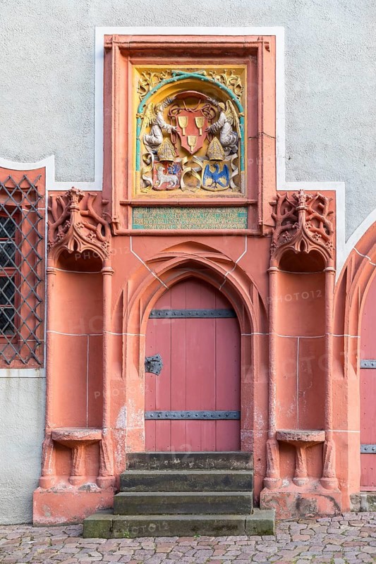 Historic pointed arch portal with seating niches and coat of arms at the cathedral provost's office on Albrechtsburg Cathedral Square, Meissen, Saxony, Germany