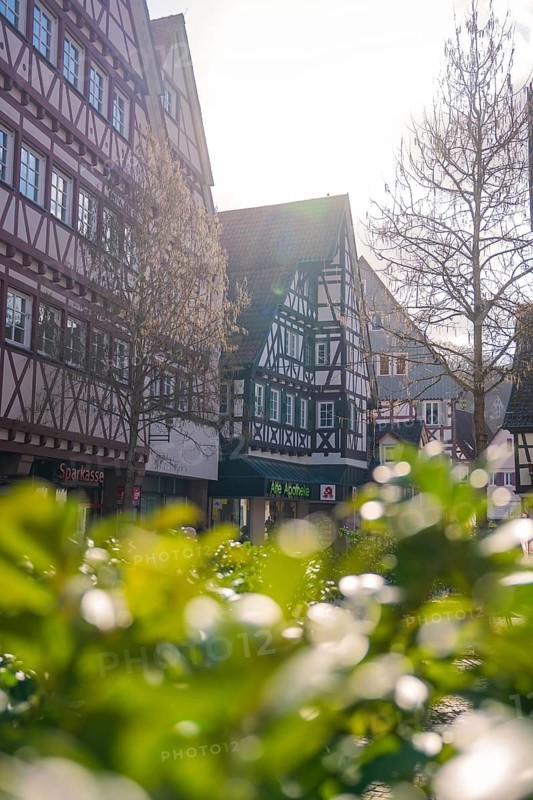 Idyllic old town with half-timbered houses and bright sunshine, Calw, Black Forest, Germany