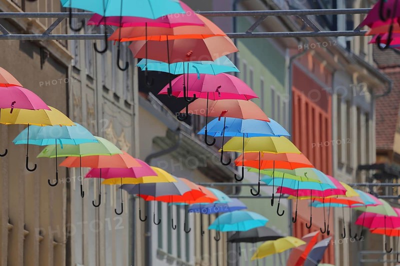 Decoration with colorful parasol, row of umbrellas, series, stony path, Eisenberg, Thuringia, Germany
