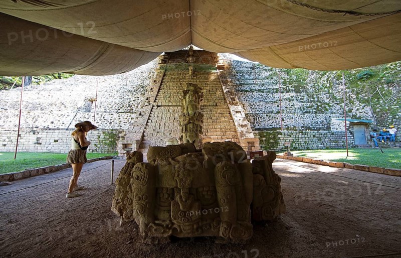Stone sculpture and hieroglyphic staircase at Copán Archaeological Site, Mayan Ruined City in the Rainforest or Jungle, Copán Department, Honduras