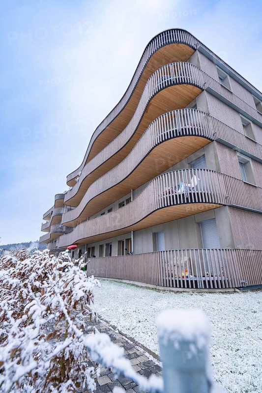 Modern residential building with wooden elements in snowy winter, Nagold, Black Forest, Germany