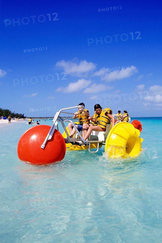 Central America, Caribbean, children with water buggy, Bahamas