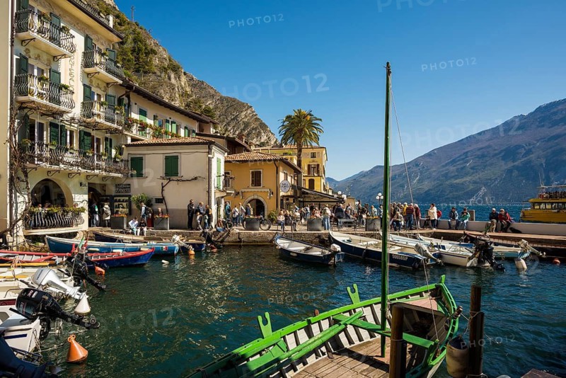 Picturesque village and colorful houses on the lake and steep mountains, Limone sul Garda, Lake Garda, Brescia province, Lombardy region, Italy