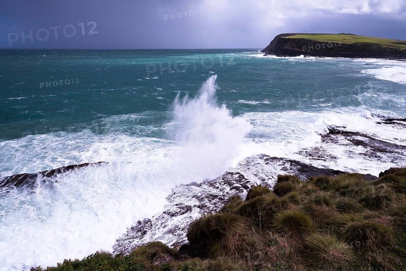 New Zealand, South Island of New Zealand, blue sea, ocean coast, dark sky, ominous sky, sea spray