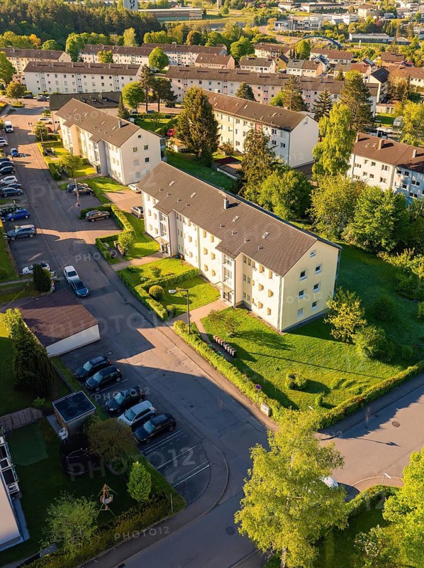 Streets and houses in a green residential area seen from the air, Calw, Black Forest, Germany