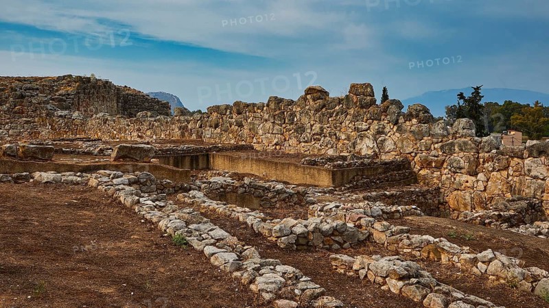 Convoluted stone ruins under an open sky in a setting steeped in history, Tiryns, ancient city in Argolis, Mycenaean, Peloponnese, Greece