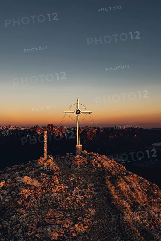 Summit cross, sunrise hiking tour on the Säuling in the Allgäu in Bavaria, Germany