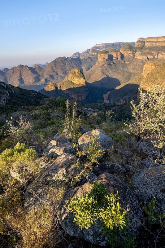 Sunset at Blyde River Canyon with Three Rondawels peak, view of canyon with Blyde River and Mesa mountains in the evening light, Upper Viewpoint, canyon landscape, Panorama Route, Mpumalanga, South Africa