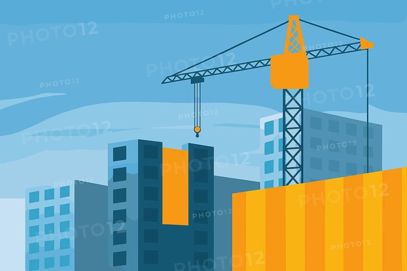 A crane is actively lifting materials at a construction site within a cityscape, surrounded by modern buildings and a clear blue sky