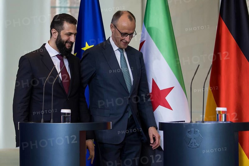 Ahmed al-Sharaa (President of the Syrian Arab Republic) and Friedrich Merz (Chancellor of the Federal Republic of Germany, CDU) on their way to the press conference after a one-on-one meeting at the Federal Chancellery, Berlin, 30 March 2026