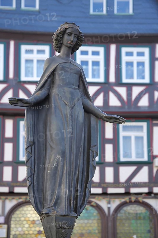 Sculpture of Saint Barbara of Nicomedia, martyr, female figure, outstretched arms with gesture, fountain, Eisenmarktbrunnen, Eisenmarkt, Wetzlar, Hesse, Germany