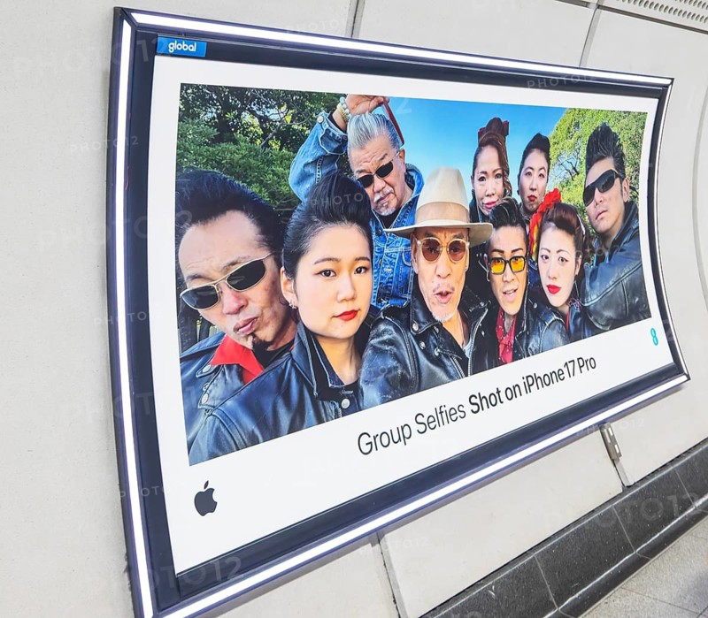 Advertising poster for Group Selfies Shot on iPhone 17 Pro, Transport for London (TfL) underground train station, London, England, UK