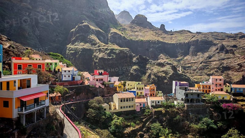 Panoramic view, small settlement, colorful village, picturesque nestled in raw, dramatic mountains under blue skies, spectacular hiking, natural heritage, cultural heritage, terraces in Fontainhas, Santo Antao, Cabo Verde, Cape Verde, Cape Verde, Cape Verde