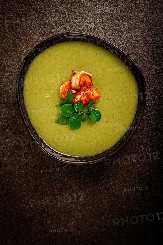 Pea cream soup, with shrimp, green soup, homemade, top view, no people