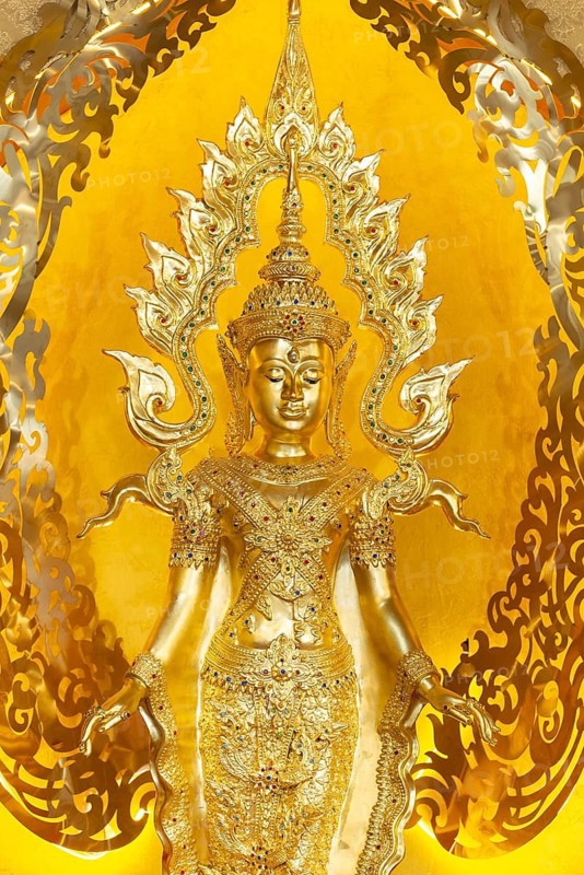 Symbolic depiction of Buddha as an enlightened, radiant and royal being, with a flame-shaped ornamental halo (aureole), Buddhist temple complex Wat Phra That Sorn Kaew, Phetchabun province, Thailand
