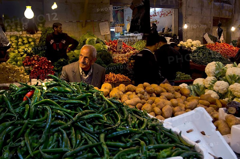 Amman, Jordan. December 4th 2012 Jordanian market traders in a popular Downtown Souk selling fruit and vegetables, Amman, Jordan