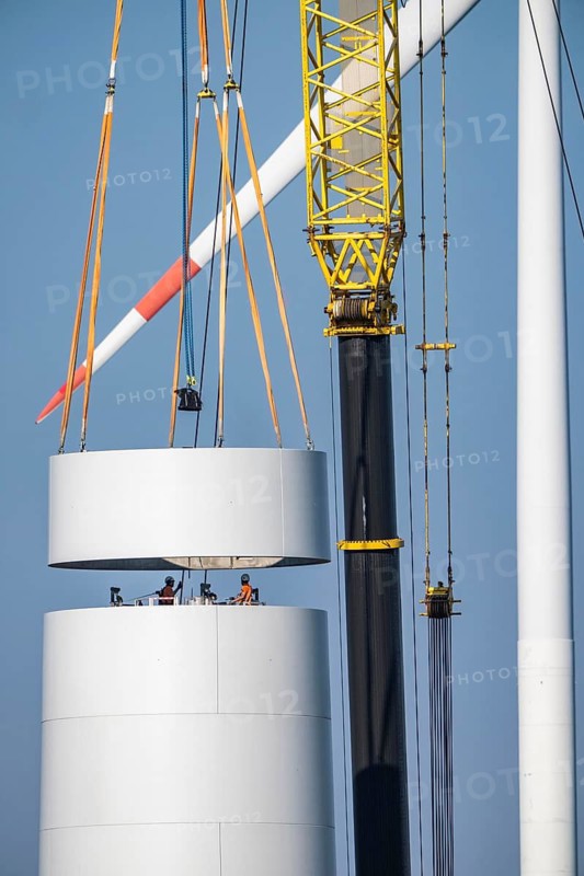 Construction site of the new Bedburg 3 wind farm, on recultivated open-cast mining site, 9 wind power plants with an output of 60 megawatts are being built, installation of the wind turbine tower operated by RWE and the city of Bedburg, North Rhine-Westphalia, Germany