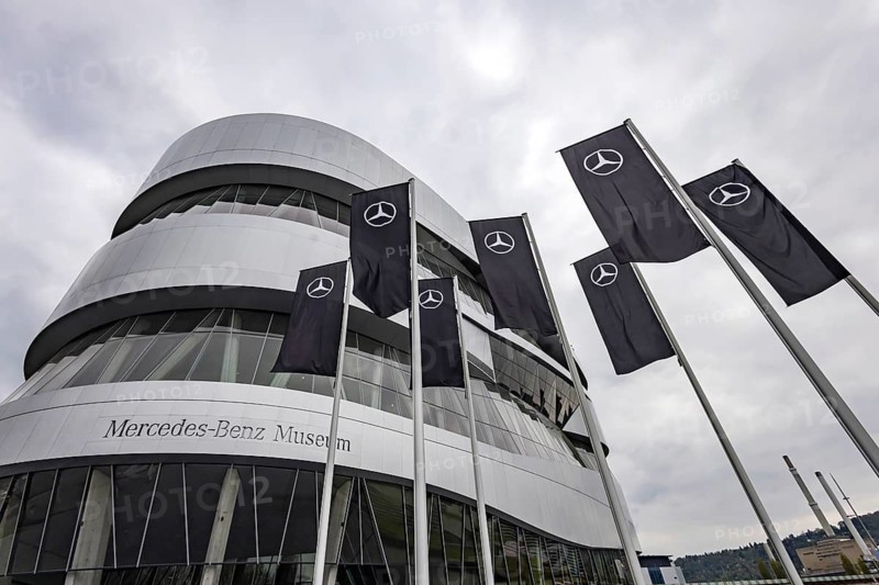 Mercedes-Benz Museum Stuttgart. Exterior view. The Automobile Museum presents a journey through the automotive history of the global corporation. In front of it, flags with the Mercedes star. Stuttgart, Baden-Württemberg, Germany
