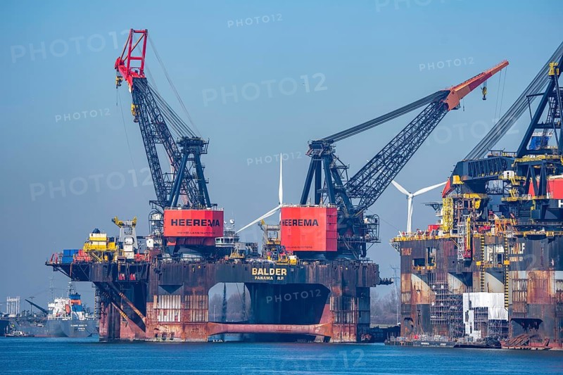 Petroleumhaven, two of the largest floating cranes in the world, Heerema Thialf and Balder are being serviced, they are working vessels for the construction of offshore structures, such as conveyor platforms, subsea pipelines, wind farms, bridges, in the port of Europort in Rotterdam, the Netherlands