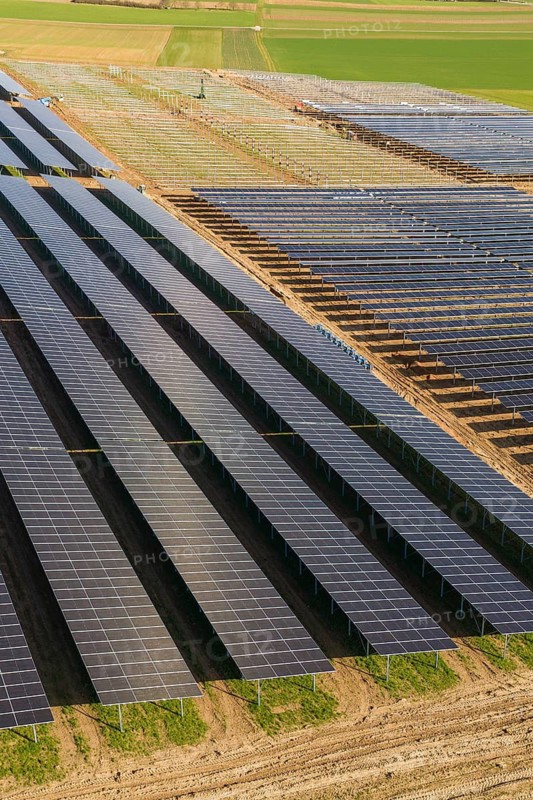 Extensive solar fields with uniform, parallel rows of panels in a natural environment, Agri PV Bau für Landwirtschaft, Enzkreis, Germany