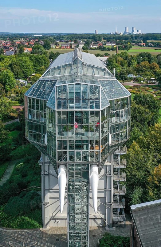 Hamm, North Rhine-Westphalia, Germany - The Maximilianpark in the Westphalian city of Hamm is a leisure park that has been built on the site of the disused Maximilian colliery since the 1984 State Garden Show and whose landmark is the glass elephant, a walk-in sculpture around 40 metres high. The Uniper power station Datteln 4 is in the background