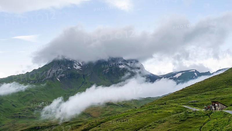 Clouds move around mountain peaks, Grindelwald First, Bernese Alps, Bernese Oberland, Switzerland