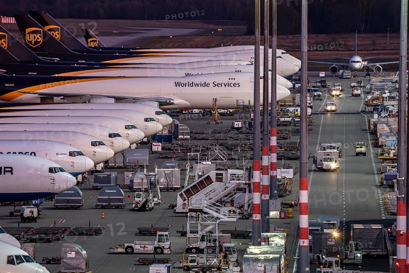 Cologne-Bonn airport, CGN, air freight center, UPS Logisic Hub, UPS cargo aircraft on the apron, Star Air Cargo aircraft, Maersk, at the logistics center, in the evening