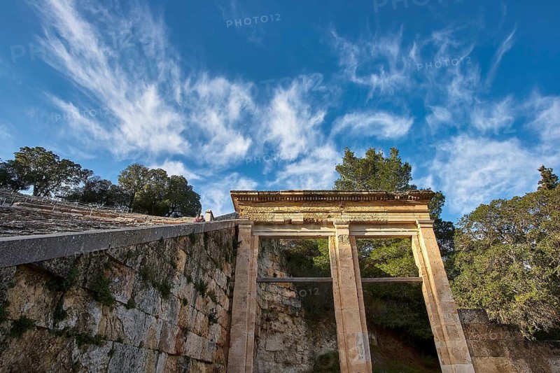 Ancient triumphal gate at the entrance of an amphitheatre in front of a clear blue sky, Ancient Amphitheatre, Epidaurus, Peloponnese, Greece