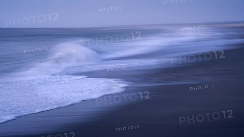 Okarito Beach in the evening with sea and sandy beach. Long exposure, blurred (ICM) . Westland Tai Poutini National Park, West Coast, South Island, New Zealand