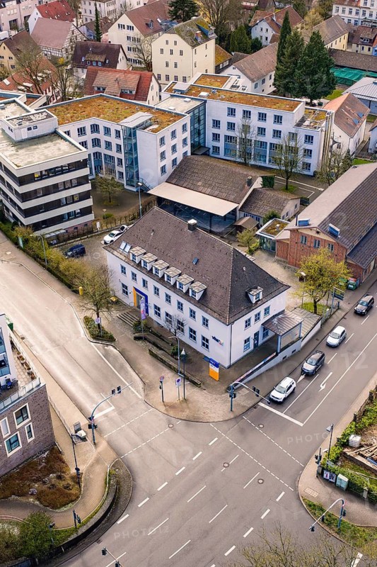 Urban environment with various buildings and a central road junction surrounded by green spaces, VHS Oberes Nagoldtal, Nagold, Germany