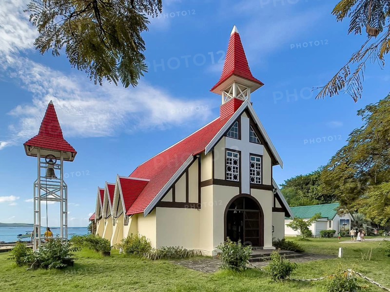 Excursion destination Photo motif for tourists Church of Notre-Dame Auxiliatrice de Cap Malheureux by the sea in the background Indian Ocean, Cap Malheureux, Mauritius