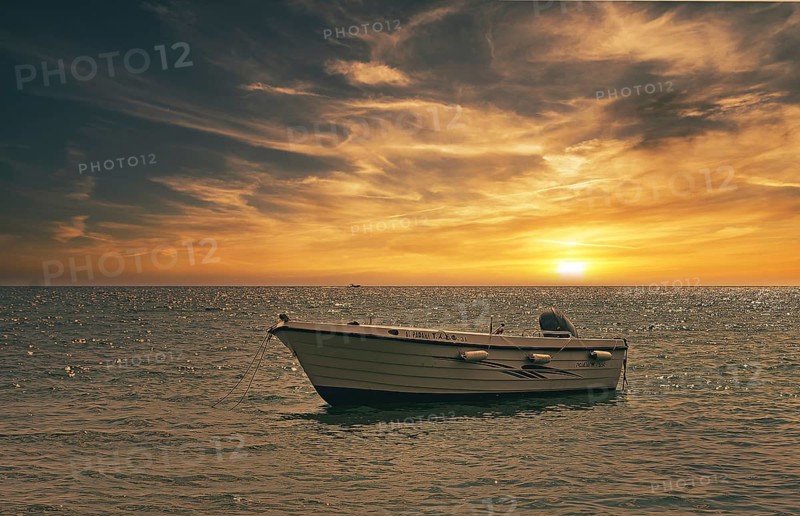 Small boat in the sunset, South Crete, Crete, Greece