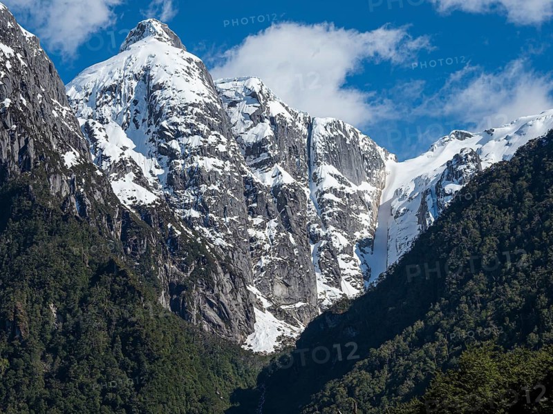 Snowcovered mountain range along river Rio Norte in the valley Valle Exploradores, road from Puerto Rio Tranquilo to Bahia Exploradores, Patagonia, Chile