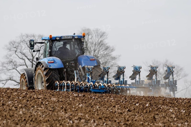 A tractor from the Jahnsfeld Biolandhof is pulling a seed furrow to sow gluten-free oats in the next few days. In addition to rye and wheat, oats and spelt are used as bread and baked grains on the organic farm's arable land, Müncheberg, Brandenburg, Germany