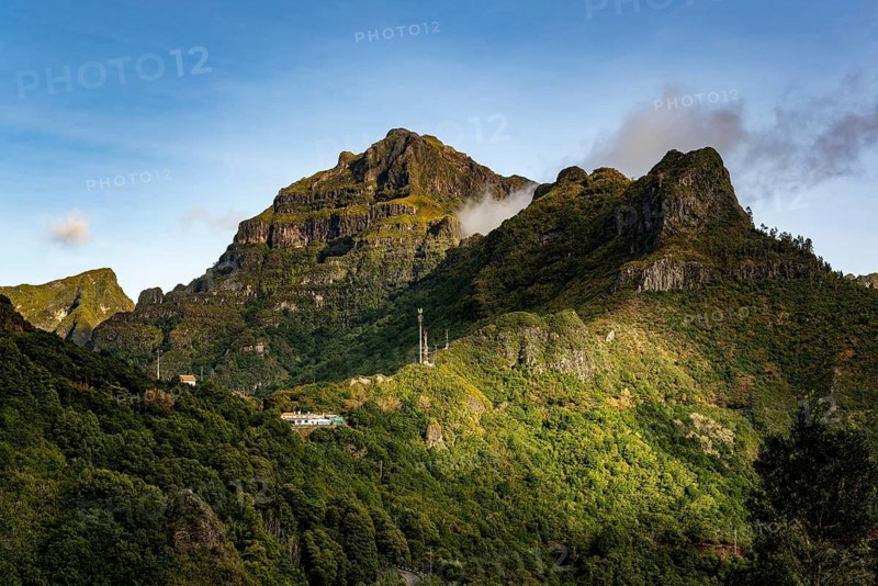 View of the top of the Boca da Encumeada pass, mountains of the Massif Central with lush vegetation in the morning light, calm and majestic, Laurisilva laurel forest, Madeira, Portugal