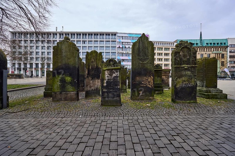 Historical gravestones, general architecture, pavement made of cobblestones, diffuse light, cloudy, Goseriede street, Hanover, state capital, Hanover region, Lower Saxony, Germany