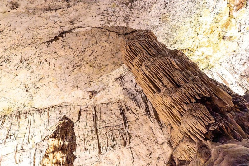 Majestic stalagmite formation inside postojna cave, a popular tourist attraction in slovenia, showcasing the beauty of nature's underground artistry