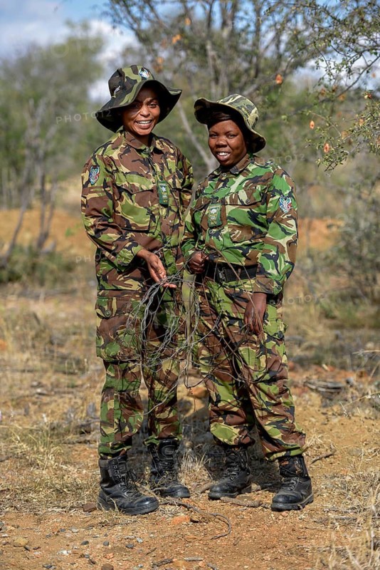Two women from the anti-poacher unit Black Mambas with confiscated poacher snares, Balule Game Reserve, Limpopo Province, South Africa