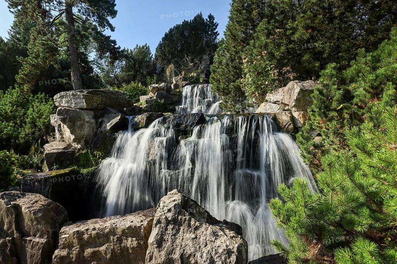 Essen, North Rhine-Westphalia, Germany - Alpinum with waterfall, Grugapark, a park in Essen, emerged from the first Great Ruhrland Horticultural Exhibition in 1929, was the park grounds of the 1965 Federal Garden Show