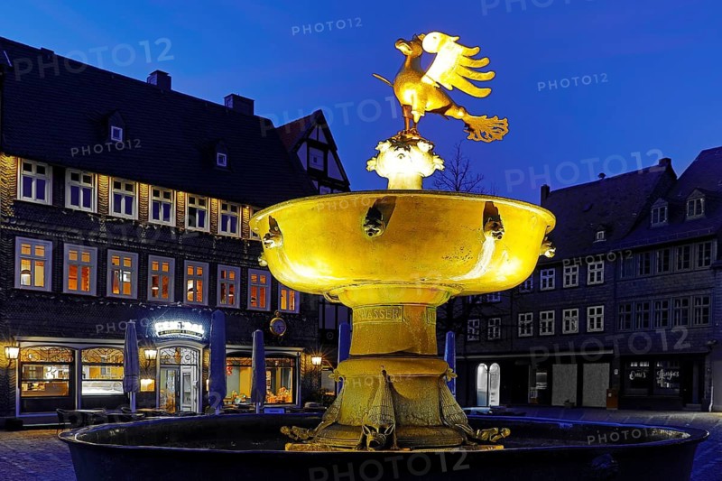 Gilded imperial eagle as a fountain eagle on the market fountain in the evening, Goslar, UNESCO World Heritage Site, Lower Saxony, Germany