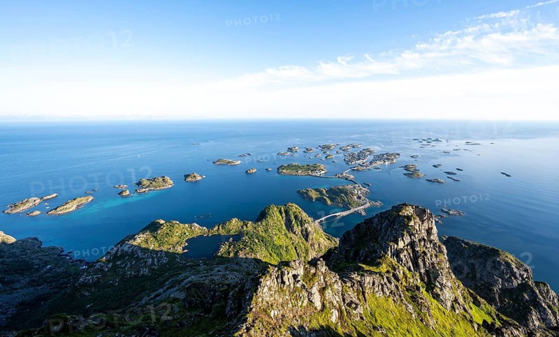 View of numerous small rocky islands with houses, at the summit of Festvågtind, view of Henningsvær, Vågan, Lofoten, Nordland, Norway
