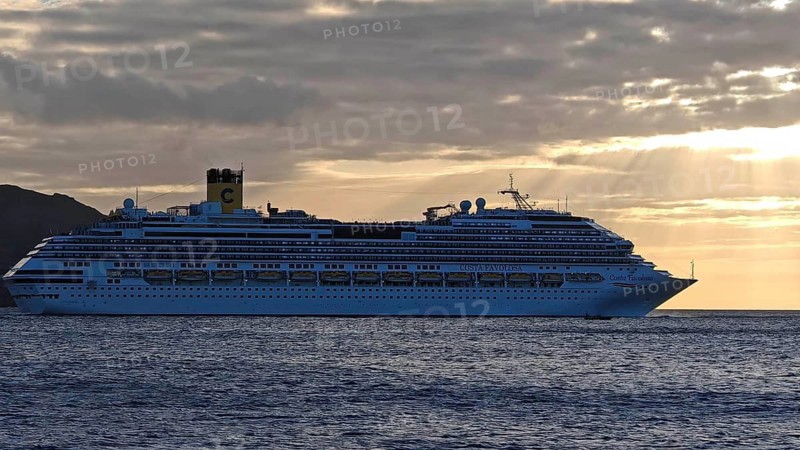 Large cruise ship, Costa Favolosa, on the sea at sunset with atmospheric clouds, Mindelo, Sao Vicente, Cabo Verde, Cape Verde, Cape Verde
