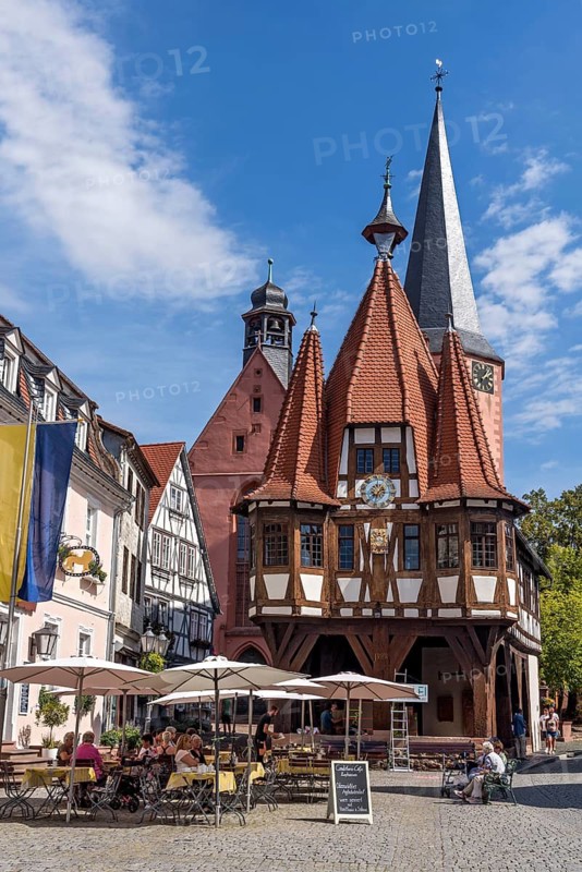 Old town hall, late medieval half-timbered building, Gothic, cultural monument, bell tower of the town church, street café, pedestrian zone, market square, historic old town, Michelstadt, Odenwald, Hesse, Germany