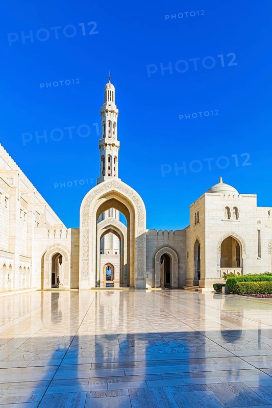 Arched gates and minaret of the Sultan Qaboos Mosque, Muscat, Arabian Peninsula, Sultanate of Oman