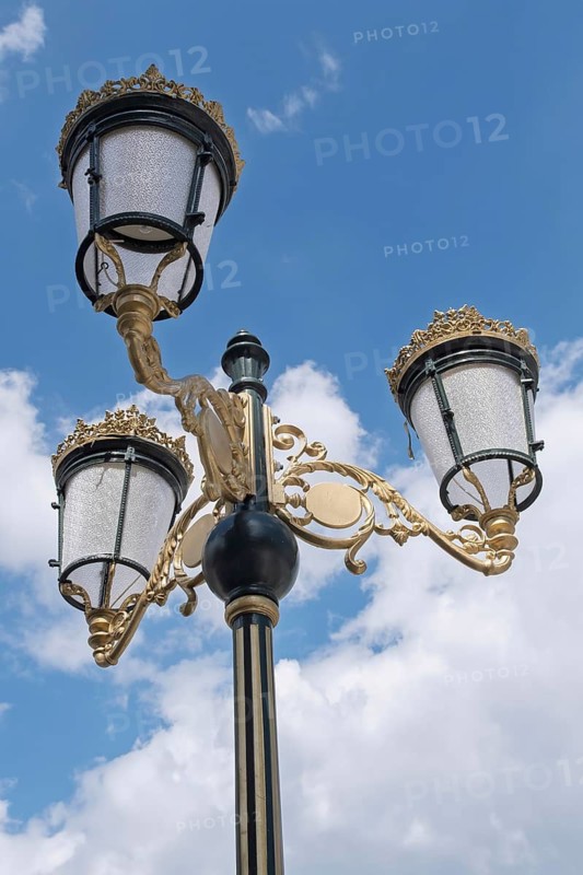 Three-armed street lamp in front of blue sky with clouds, Macedonia Square, Skopje, North Macedonia, Balkans