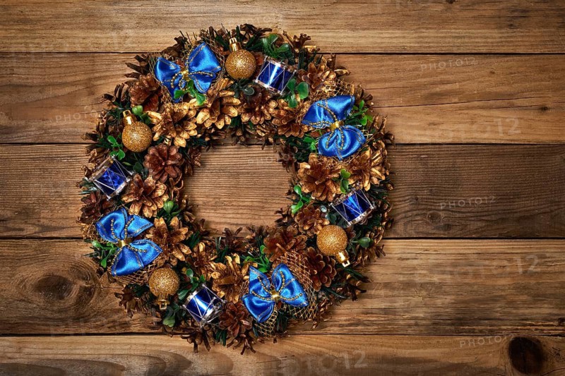 Christmas wreath on old wooden background
