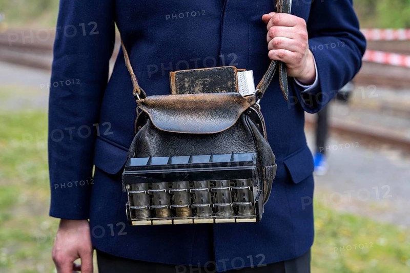 Conductor of a museum train, with so-called gallop changer or quick coupler, a manually operated coin changer, Bochum railway museum, museum days weekend, with many attractions such as steam locomotive rides, 3 locomotives are under steam, historic trains make round trips through the Ruhr Valley, many locomotives are on display, on the site of the former Dahlhausen railway depot, North Rhine-Westphalia, Germany