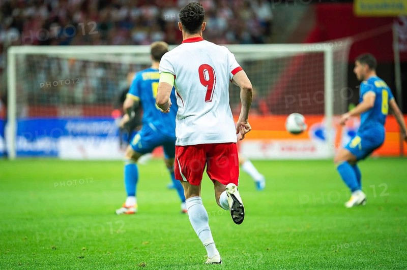 Soccer player capitan with number 9 on his back during the match