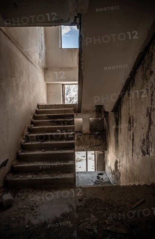 Abandoned destroyed staircase in a residential building, Soviet apartment blocks, ghost town, Engilchek, Tian Shan, Kyrgyzstan